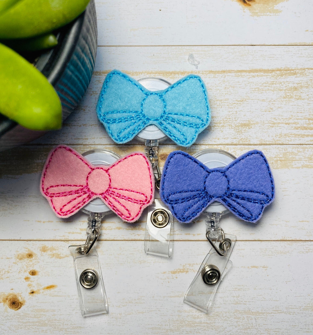 Bow retractable badge reel for nurse,