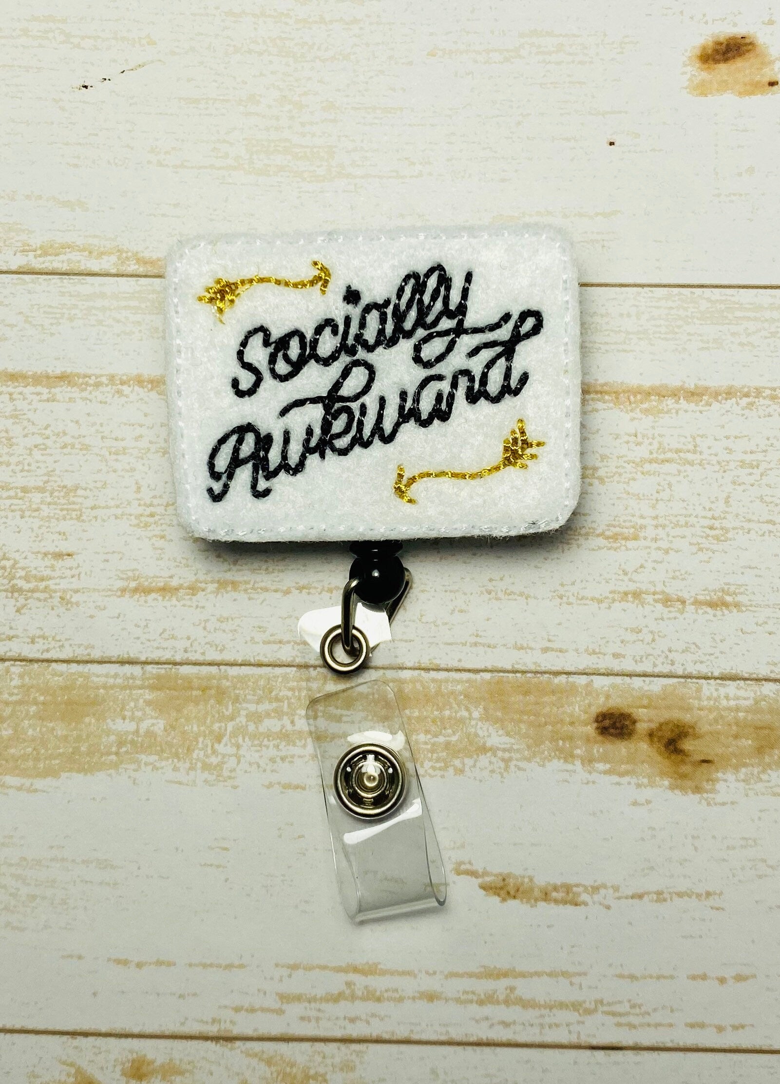 Socially awkward retractable badge-reel, lanyard is clip,