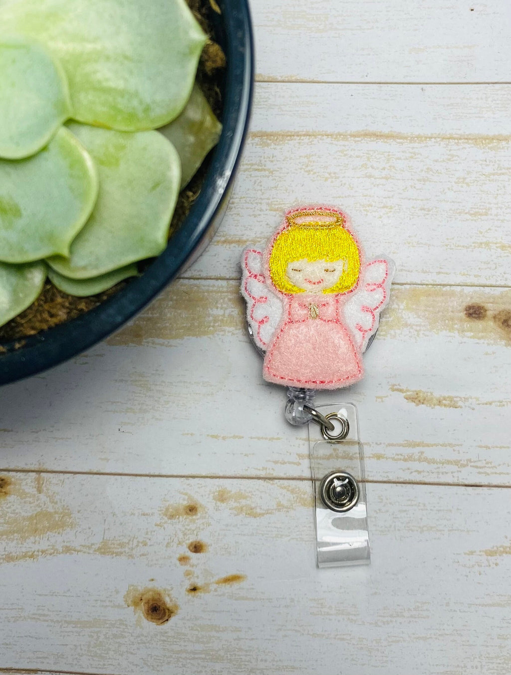 Guardian angel retractable badge reel,