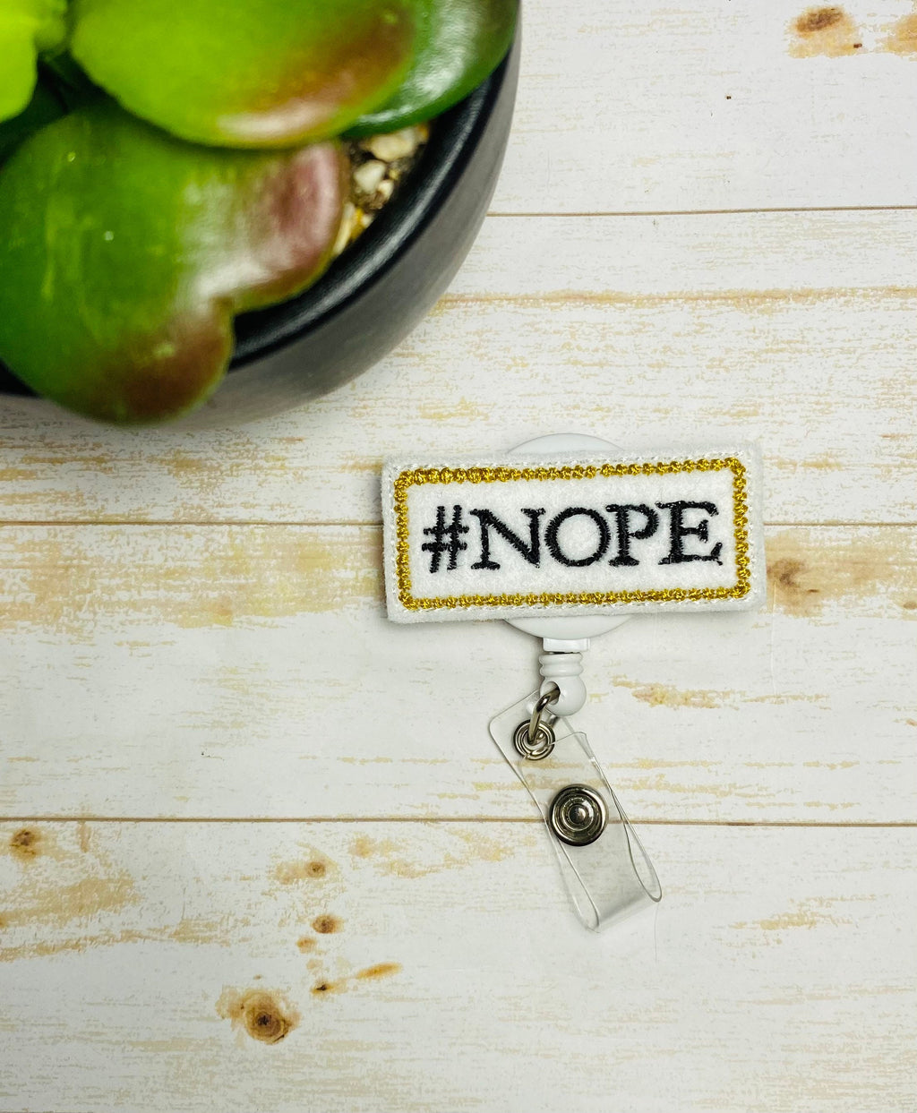 nope retractable badge reel,