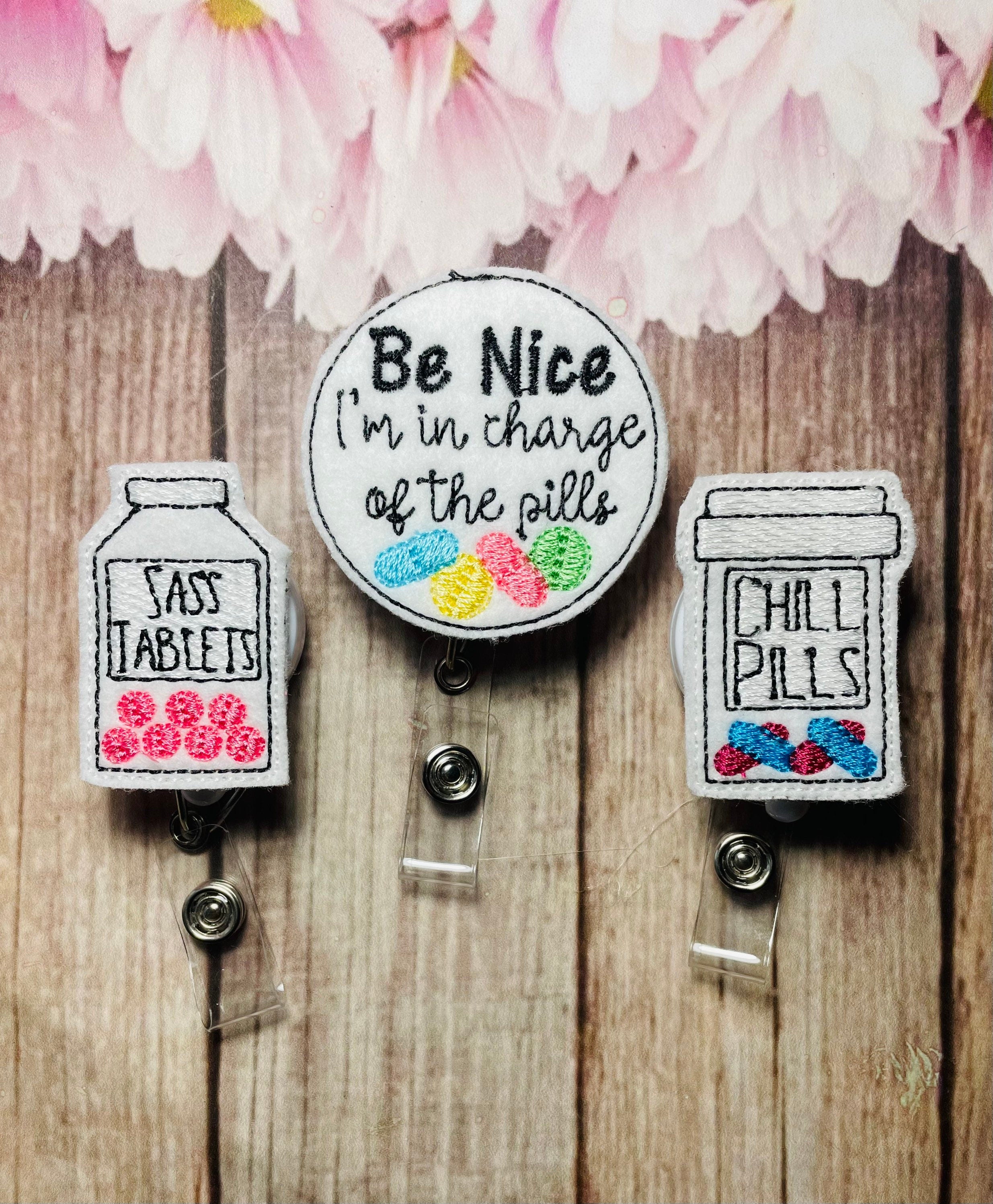Be nice I'm in charge of the pills pharmacy badge reel – tabbycatclips