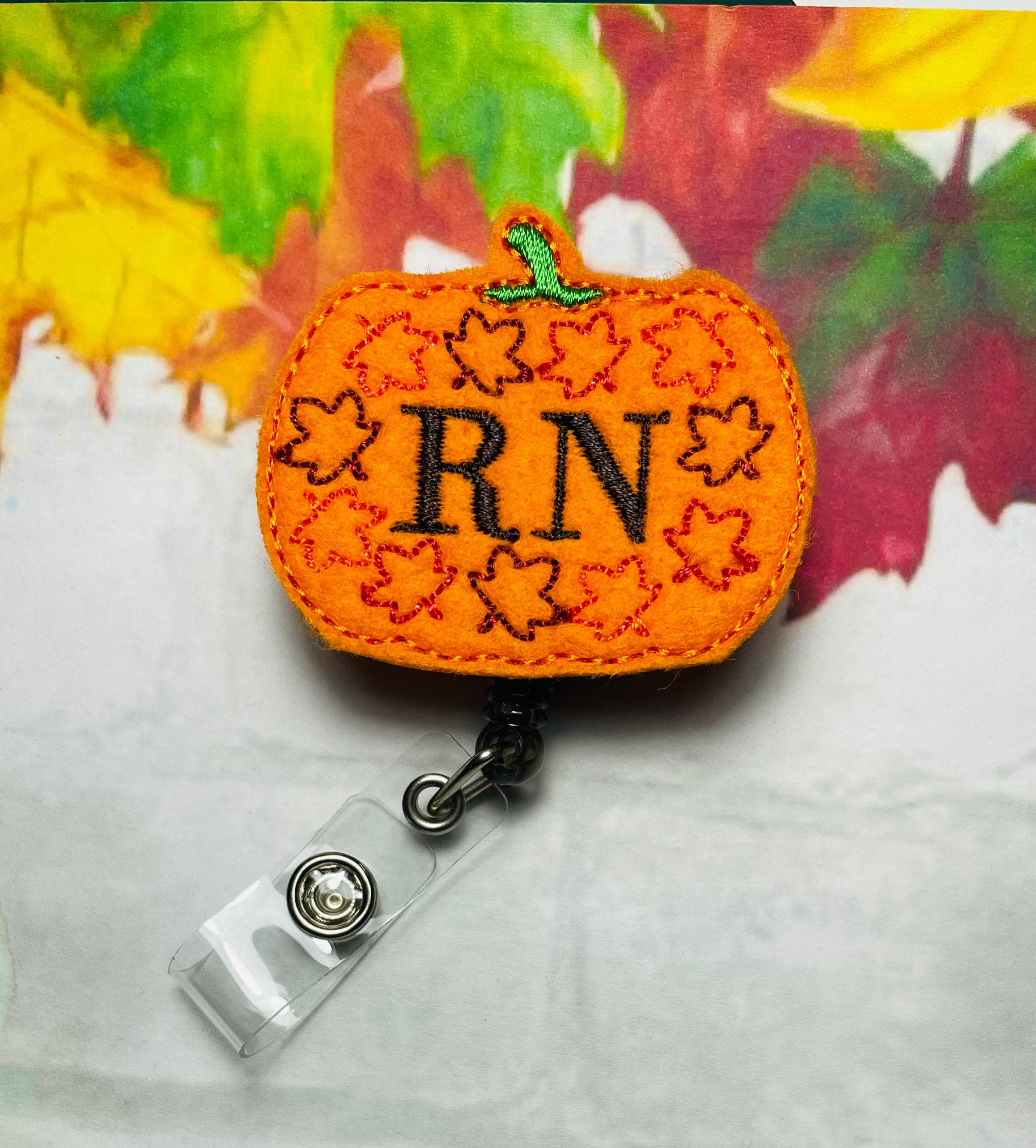 Registered nurse pumpkin badge reel