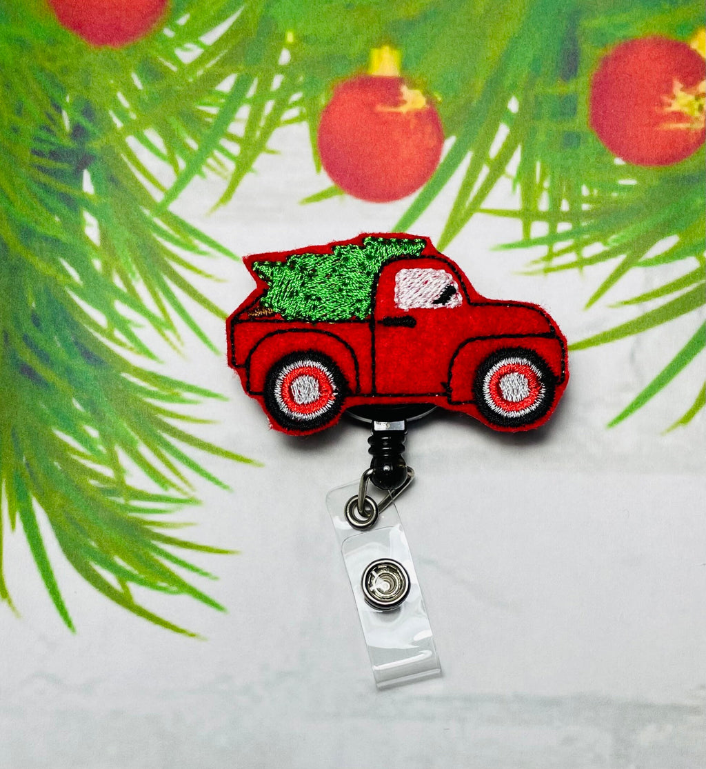 Vintage Christmas truck retractable badge reel,