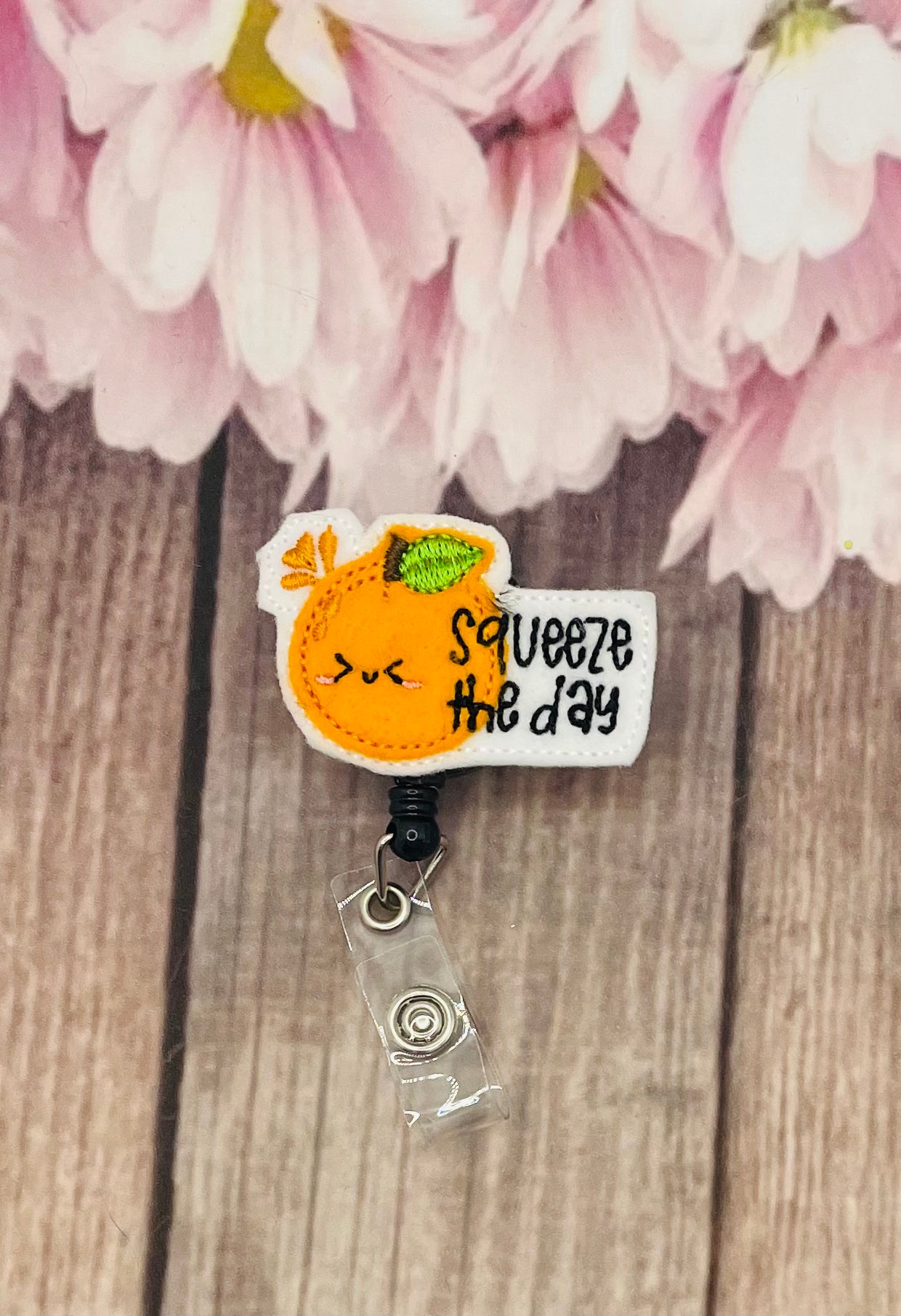 Squeeze the day pin badge reel